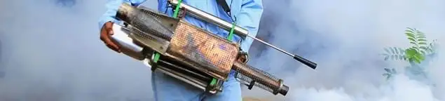 Fumigation technician using a fogger for deep pest treatment in Honolulu, HI